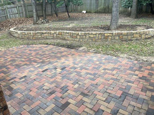 Extended patio with pavers and added a retaining wall to help with drain issues