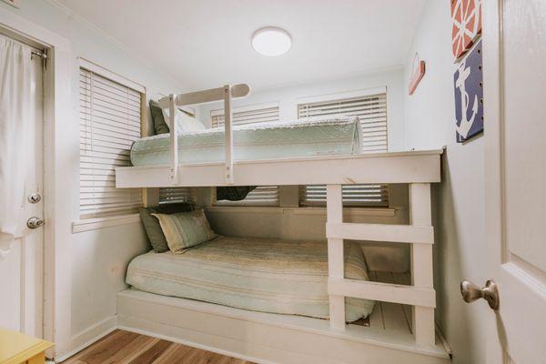 Twin bunk beds in second bedroom with smart tv in Bellande Cottage