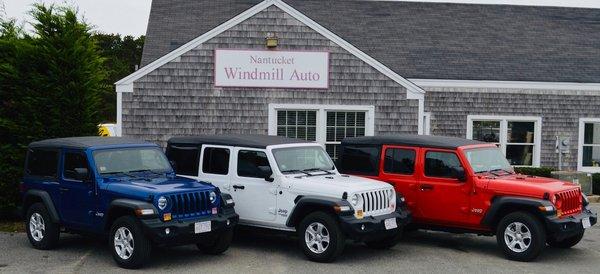 Two and four door Jeep Wranglers,  Some of our four door models are the new electric top version.