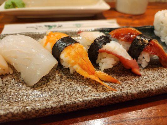 Trying to demonstrate that the nigiri slices are unacceptably thin. If I were this level of thin, I'd be malnourished.