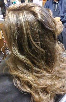 Highlights and layered haircut with beautiful homaid curls...