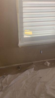 Repaired and painted wall due to a leaky window.