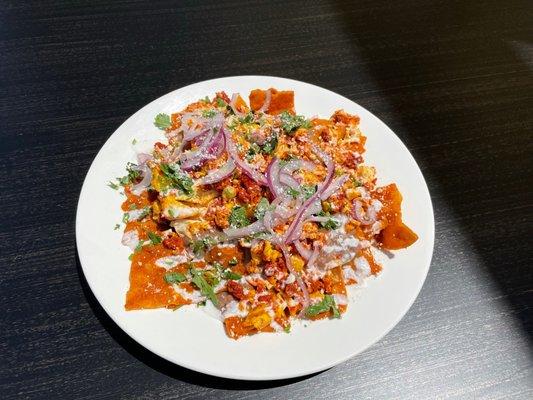 Chilaquiles with spicy árbol salsa, scrambled eggs and chorizo