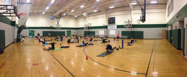 The 6am boot camp members doing may based core exercises at the boys and girls club location before moving on to stations.