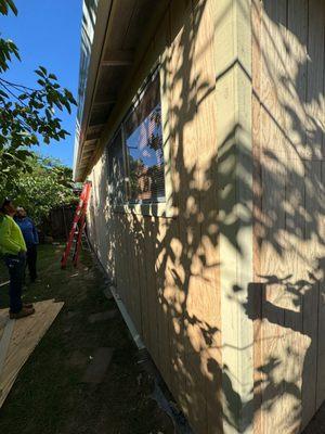 Exterior wood siding being installed