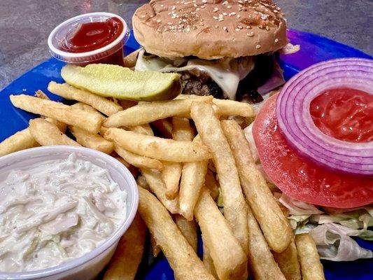 Veggie burger with white American cheese and grilled mushrooms. Refreshing coleslaw. Good fries. Nice crunchy pickle.