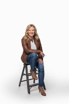 Branding picture of women sitting in front of white background