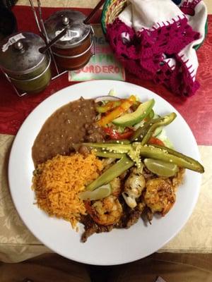 Parrillada San Miguelito (grilled steak, chicken, shrimp with grilled scallions and jalapeño). Super tasty.