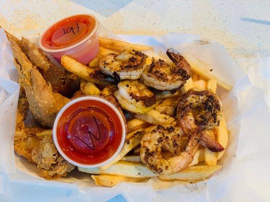 Shrimp and Wing basket served over fries !!