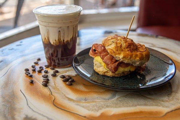 Bacon Egg & Cheese on a Cheddar Biscuit with a Vanilla Sweet Cream Cold Foam Cold Brew