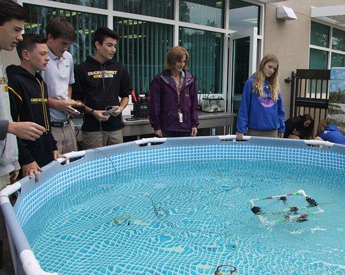 Eighth graders built and programmed underwater PVC ROVs.