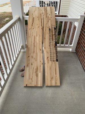 Hardwood butcher block used as desktop that was broken due to mover mishandling.