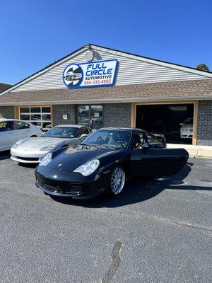 Porsche 911 Turbo in for repairs service, tire mount and balance, hand car wash, paint correction, detailing and ceramic coating services.