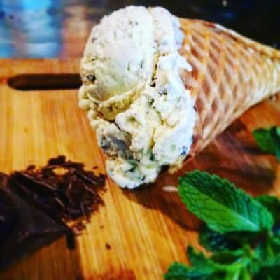 Fresh mint gelato with belgian dark chocolate chunks in our housemade waffle cone.