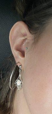 My Tragus piercing done by Cody