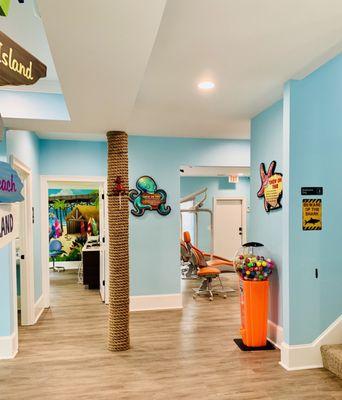 Hallway leading to cleaning area (open concept) and private room.