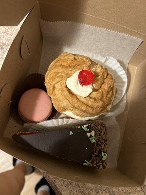 Raspberry macaroon, puff pastry with canoli filling, and rainbow cake