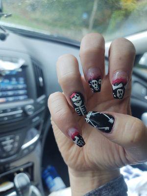 Spooky Skeleton nails done by fantastic nail artist. Showed her a pic and she did the rest!