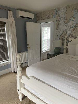 main bedroom with a door between the two bedrooms