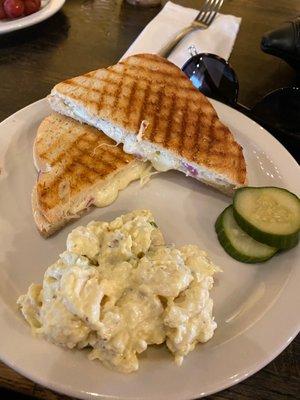 Tomato and cheese sandwich with potato salad