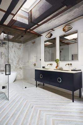 Marble master bathroom with custom vanity