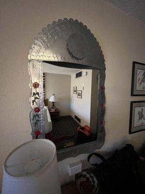 Cute tin mirror in our room.