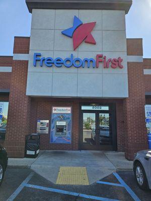 The front of the building of the Freedom First Credit Union Crossroads branch.