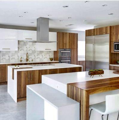 We love this kitchen !The walnut cabinetry,our Mod Glam Collection backsplash and quartz counters create a stunning contrast