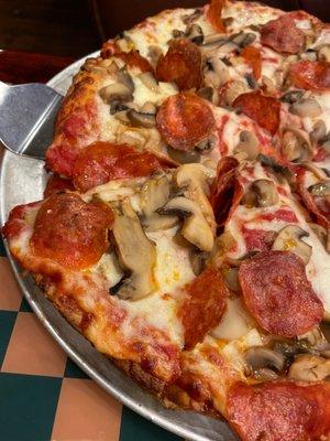 Pepperoni and mushroom pizza