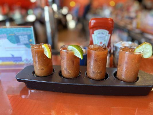 Flight of bloody Mary's.from left Regular,  spicy, maple bacon, and pickle