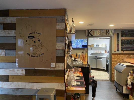 Khao Niew sign, beer taps, and kitchen