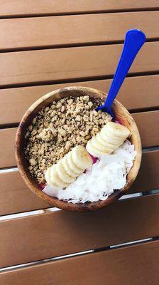 Pitaya bowl with coconut, granola bar and banana