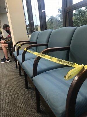 Seats taped off in the reception area