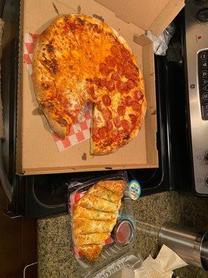 Pizza and garlic bread from pizza shop