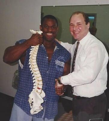 Dr. Sitzmann, having adjusted professional bodybuilder Vince Taylor, pauses for a photo. (Powerhouse Gym, 1996)