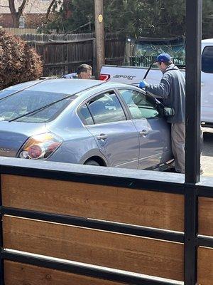 Here's a picture of the guys installing my windshield. They did a great job.! !