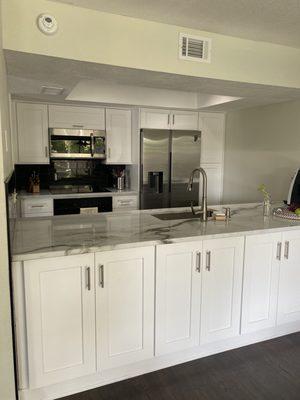 After. The view from the dining room. Love all of the storage space since this kitchen is on the smaller side.