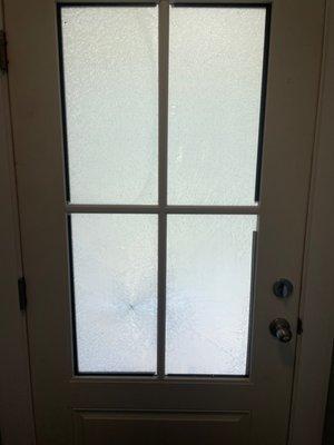 Interior view of shattered glass front door