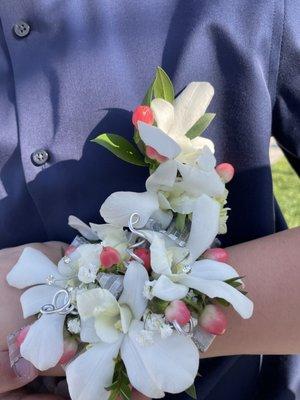 Matching corsage and boutonnière. Gave her the colors of her dress and poof once again beautiful.