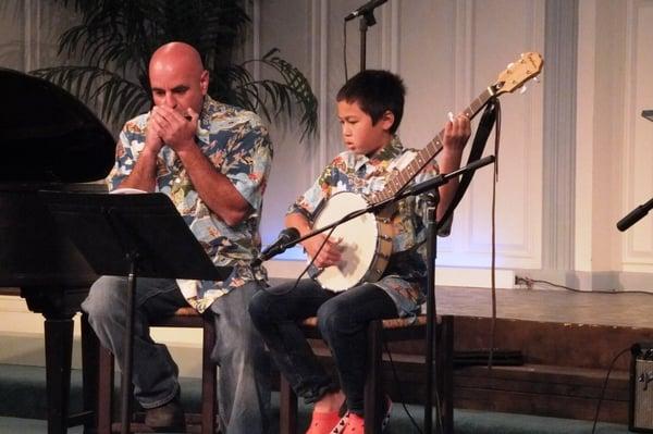 One of our teachers accompanying his banjo student at our semi-annual recital.