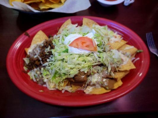 Nachos Deluxe. Nice portion, lots of toppings...but with queso instead of melted shredded cheese, not specified in the menu. Got soggy.