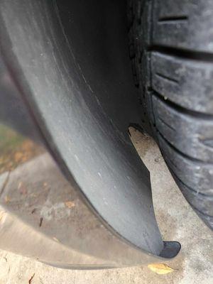 Drivers side tire wheel shield cut