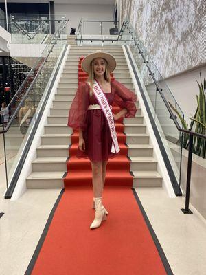 Romy posing on the staircase with red carpet!