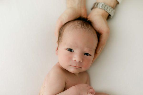 Newborn baby boy in studio.