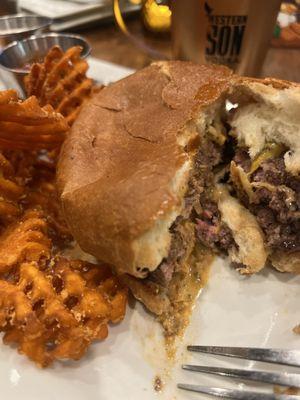 Smash burger with sweet potato fries and an apple crisp cocktail