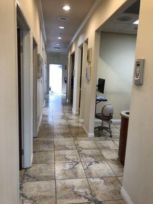 Hallway of office, leading to emergency door.