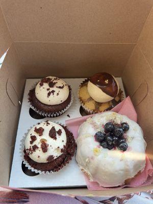 Red velvet cupcakes, Lemon berry round cake and an almond coffee cupcake