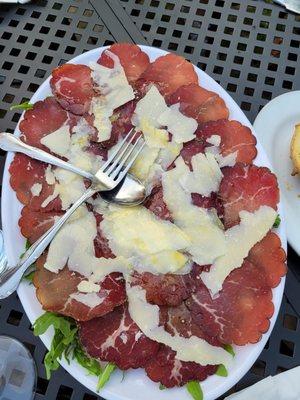 Thinly sliced dried beef with cheese and a light coating of lemon on top. Yummy