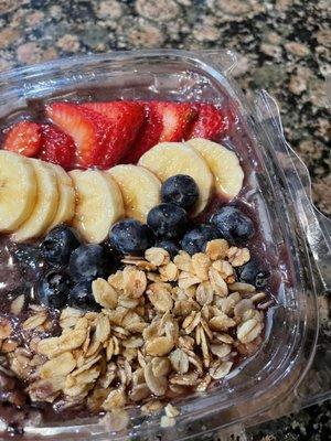 Açaí bowl hold the coco flakes drizzled with honey!