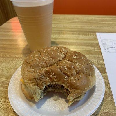 A yummy burger with onions and a nice, cool Miller Lite.